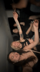 Group of four socializes in vehicle during nighttime in Turkey