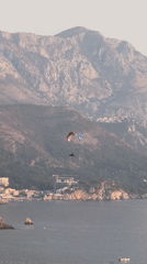 Paragliding over Boreti's bay with mountain backdrop