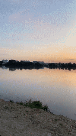 Sunset documented over lake near Aramil, Russia