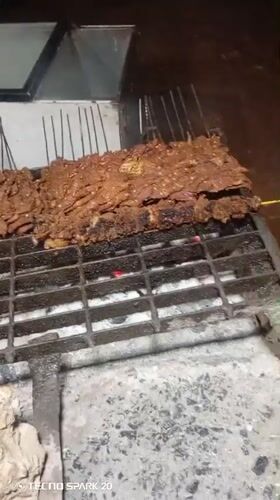 Evening grilling session captured in Tundun Wada West, Nigeria