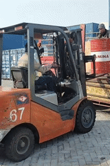 Forklift operations moving Pertamina drums at Surabaya container yard