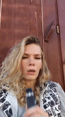 Blonde woman photographed multiple times in Russian village