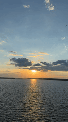 Sunset captured over Votkinsk reservoir with birds in flight