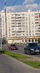Routine street activity documented in Moscow neighborhood during afternoon