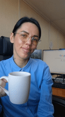 Office worker poses with mug during documented shift work moment