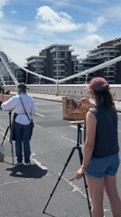 Artists painting on Albert Bridge on a sunny London morning
