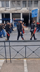 May Day demonstration with red flags marches through Athens