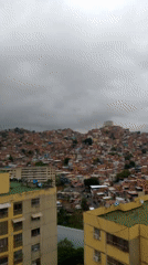 Overcast afternoon captured over dense Caracas residential district