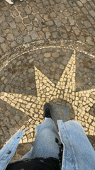 Tourist explores coastal viewpoints and pathways in Santana, Portugal