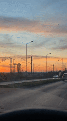 Evening traffic flows on multi-lane road in Varna