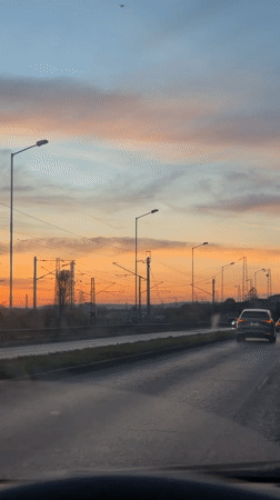 Evening traffic flows on multi-lane road in Varna