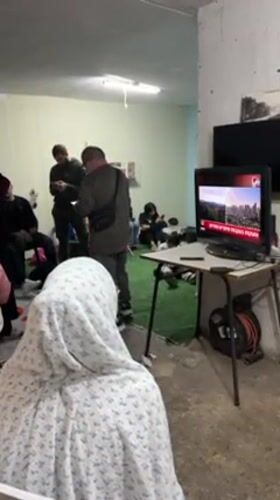 Families gather in shelter space in Tel Aviv