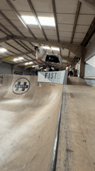 Scooter rider performs aerial tricks at Corby skate park