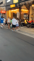 North Kuta street life: shops, scooters, and nightlife venues