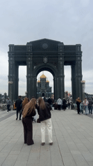 Visitors gather at memorial arch near Russian Armed Forces Cathedral