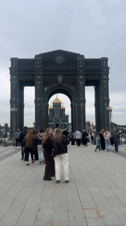 Visitors gather at memorial arch near Russian Armed Forces Cathedral