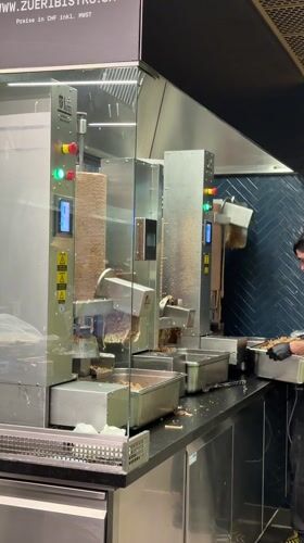Automated döner machines slice meat in Zurich kitchen
