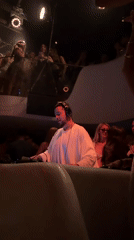 Late-night DJ set inside a red-lit Mykonos club