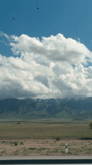 Mountain landscape filmed from moving vehicle in Kazakhstan