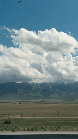 Mountain landscape filmed from moving vehicle in Kazakhstan