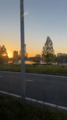 Vehicle captures sunset view of Amsterdam's iconic sign area