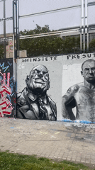 Street art documentation captured along Barcelona sports field wall