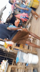 Nigerian marketplace bustling with vendors and shoppers documented