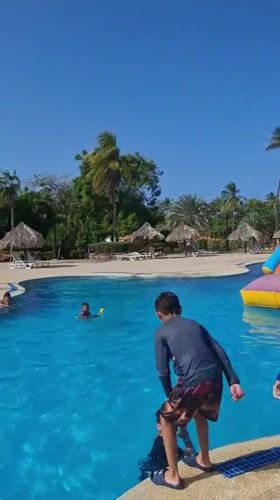 Beach resort pool activities captured at Playa El Agua