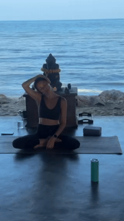 Beachfront yoga class held at thatched pavilion in Koh Samui