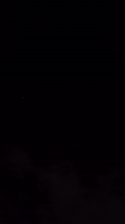 Bright moon visible through dark clouds over Johannesburg