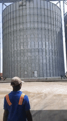 Workers conduct routine operations at Nigerian grain facility