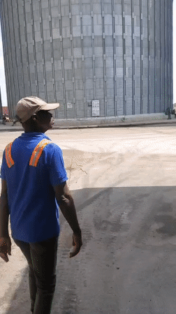 Workers conduct routine operations at Nigerian grain facility