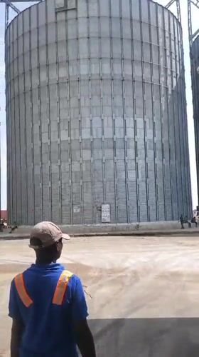 Workers conduct routine operations at Nigerian grain facility
