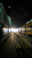 Worker tends to subway cars in Buenos Aires depot