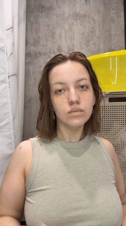 Morning skincare routine documented in Russian bathroom