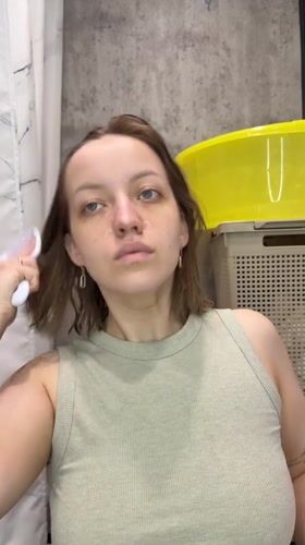 Morning skincare routine documented in Russian bathroom
