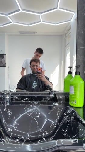 Customer documents barbershop visit with selfies in Tsarevo, Bulgaria