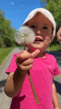 Spring day captured in Wisła: child, dandelions, viaduct, nature