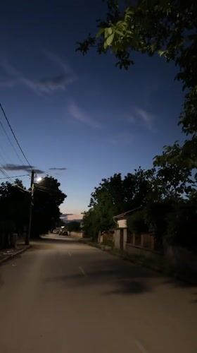 Evening dog walk through quiet streets of Malevo at dusk