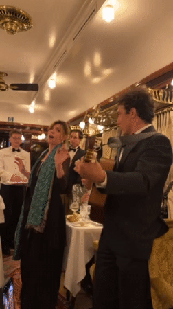 Musical duo performs in elegant French dining car