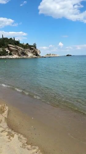 Beach resort documentation captured in Kavala, Greece during sunny afternoon