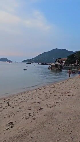 Sunset documented on Koh Tao beaches with boats offshore