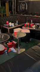 Post-party cleanup documented at Guzape bar establishment