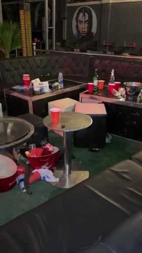 Post-party cleanup documented at Guzape bar establishment