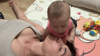 Mother and baby playtime captured in Sochi home