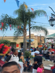 Crowded outdoor event documented in Oacalco, Mexico