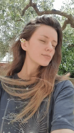 Woman photographed with pets in sunny Bar, Montenegro morning