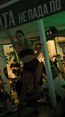 Evening pole dancing performance at a dimly lit Varna venue