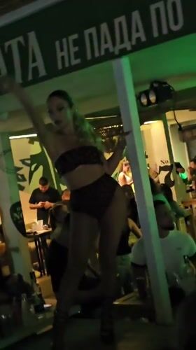 Evening pole dancing performance at a dimly lit Varna venue