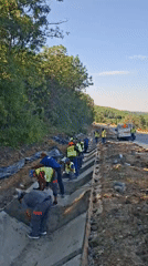 Concrete drainage channel work underway on a Hîncești roadside